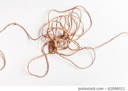 Tangled thread isolated on white illustrating concepts of complex problem, obstacle, stress Tangled thread isolated on white illustrating concepts of complex problem, obstacle, stress 62006011