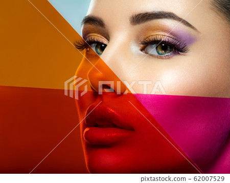 Beautiful white girl with bright eye-makeup. 62007529