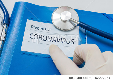 Novel coronavirus disease 2019-nCoV written on blue folder. 62007973