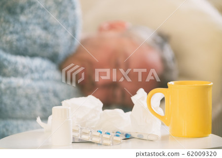 Mature man suffering from coronavirus, flu or cold Mature man suffering from coronavirus, flu or cold 62009320