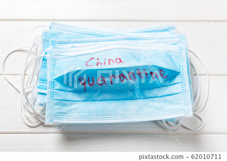 China quarantine word written on medical mask. China quarantine word written on medical mask. 62010711