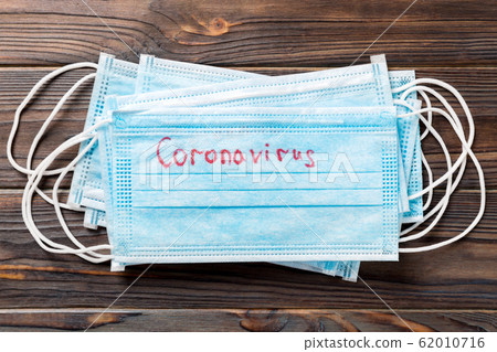 coronavirus word written on medical mask. 62010716