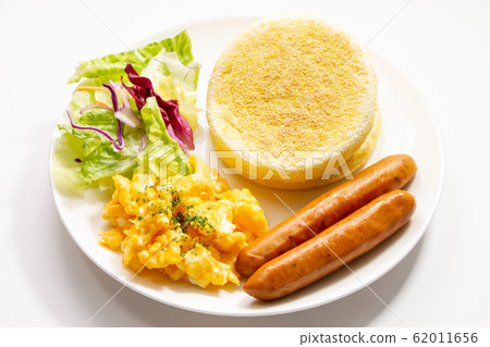One plate (white plate, white background) centered on English muffin sandwich. Images of breakfast and snacks. One plate (white plate, white background) centered on English muffin sandwich. Images of breakfast and snacks. 62011656