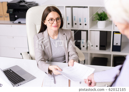 Giving filled papers Giving filled papers 62012185