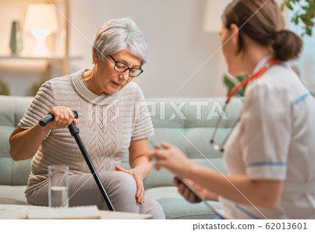 Elderly patient and caregiver 62013601