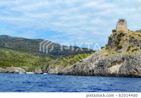 Cala Bianca Beach and the saracen tower near Cala Bianca Beach and the saracen tower near 62014480