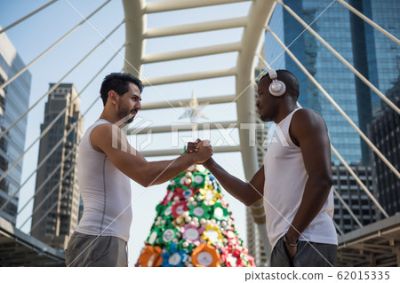 American sport athlete friends handshake in city American sport athlete friends handshake in city 62015335