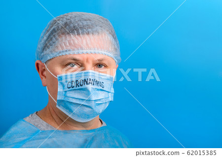 Portrait of ill man in medical unifrom and 62015385