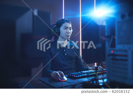 Young Man Playing Video Games in Computer Club 62016152