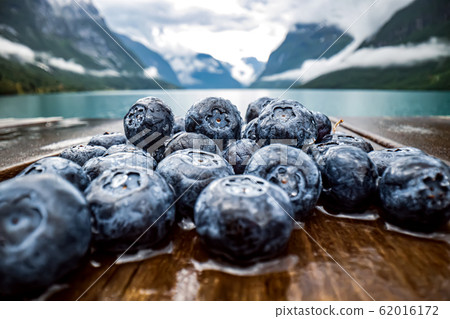 Blueberry antioxidants on a wooden table on a 62016172