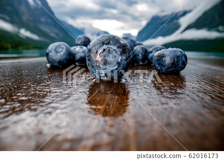 Blueberry antioxidants on a wooden table on a 62016173