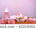 Spa composition with bowls with salt, flowers, towel, candle, crystals, soap and lotions 62016902
