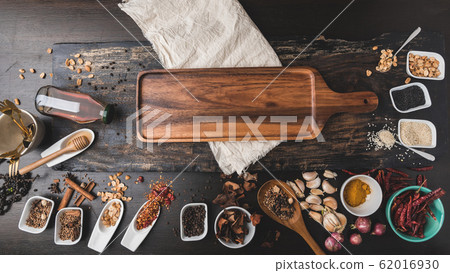 Various colorful herbs and spices on wooden table. Top view of spices and herbs. 62016930