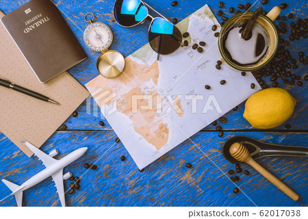 accessories for the traveler on the old background on the on blue wood table. Travel accessories for the traveler on the old background on the on blue wood table. Travel 62017038