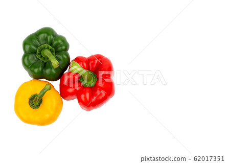 Green, red and yellow bell peppers on isolated Green, red and yellow bell peppers on isolated 62017351