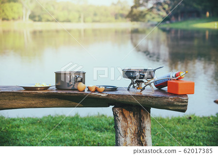 The background of the pot and gas picnic that is placed on the table wooden. Camping, 62017385