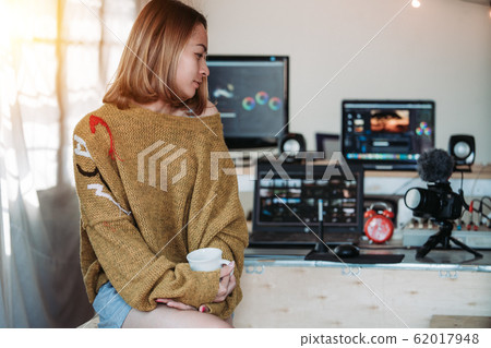 Editing vlog or lady blogger working in the house 62017948