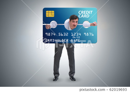 Businessman in credit card burden concept in pillory Businessman in credit card burden concept in pillory 62019693