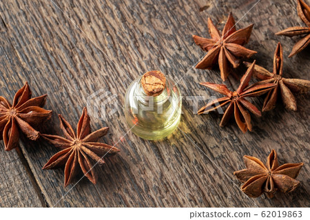 A bottle of star anise essential oil with star anise 62019863