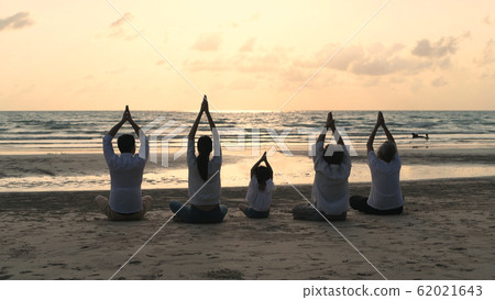 Holiday concept. A large family practicing yoga 62021643