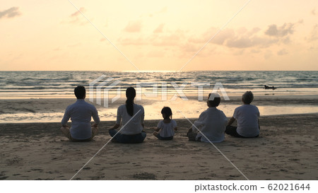 Holiday concept. A large family practicing yoga 62021644