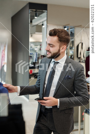 Stylish man buying clothes Stylish man buying clothes 62022151