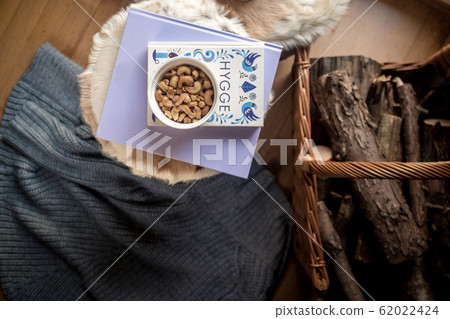 cozy home concept, danish hygge style and their art of happy life, mood of coziness with feelings of wellness cozy home concept, danish hygge style and their art of happy life, mood of coziness with feelings of wellness 62022424