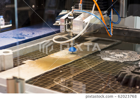 Sheet of metal and hands of worker who works on Sheet of metal and hands of worker who works on 62023768