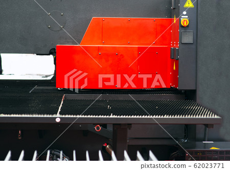 Sheet of metal and hands of worker who works on Sheet of metal and hands of worker who works on 62023771