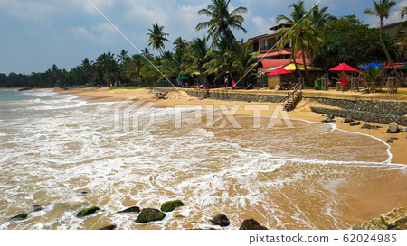 Sandy coast of the ocean. Paradise tropical island Sandy coast of the ocean. Paradise tropical island 62024985