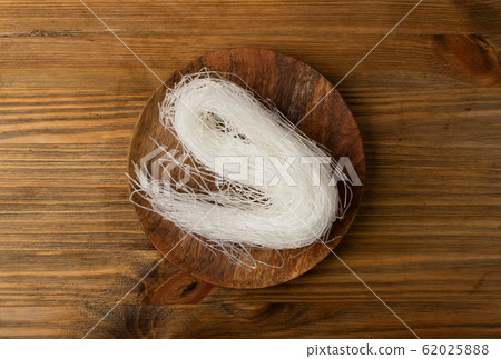 Raw dry rice noodles. Traditional asian rice Raw dry rice noodles. Traditional asian rice 62025888