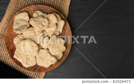 Raw Dehydrated Soy Meat or Soya Chunks on Black Raw Dehydrated Soy Meat or Soya Chunks on Black 62026471