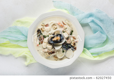 Clam chowder in a white plate. The main 62027450