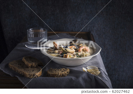 Clam chowder in a white plate. The main 62027462