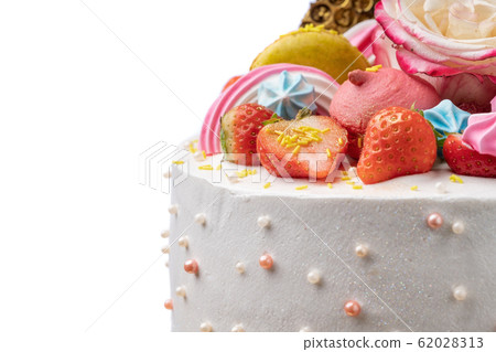 Cake of strawberries, chocolate, marshmallows, roses and sweet decorations close-up, 62028313