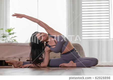 Asian woman practice yoga to meditation in bedroom Asian woman practice yoga to meditation in bedroom 62028898