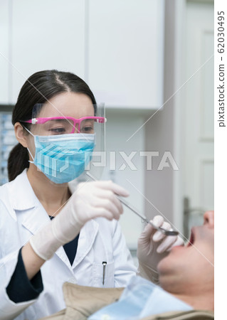 Healthcare, medicine and people concept. Female or Male doctor working in hospital 296 62030495