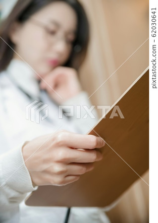 Healthcare, medicine and people concept. Female or Male doctor working in hospital 152 Healthcare, medicine and people concept. Female or Male doctor working in hospital 152 62030641