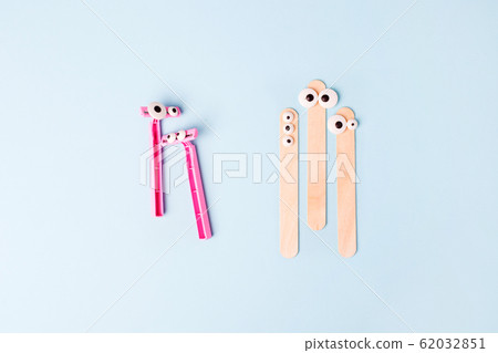 Tools for depilation on blue background - pink Tools for depilation on blue background - pink 62032851