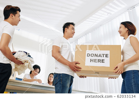 Students working as volunteers Students working as volunteers 62033134
