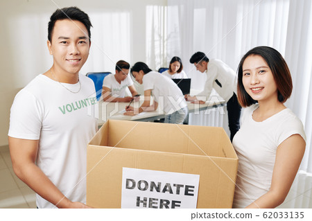 People carrying donation box People carrying donation box 62033135
