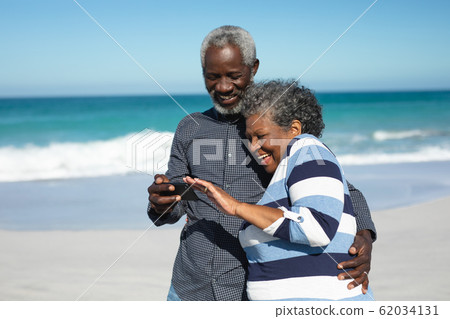 Old couple looking a phone Old couple looking a phone 62034131
