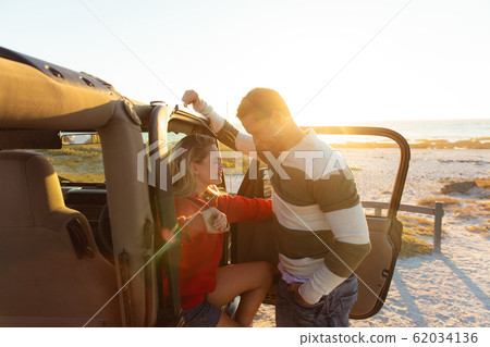 Couple with a car enjoying free time Couple with a car enjoying free time 62034136