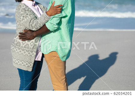 Old couple in love at the beach Old couple in love at the beach 62034201