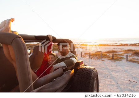 Couple with a car enjoying free time Couple with a car enjoying free time 62034210
