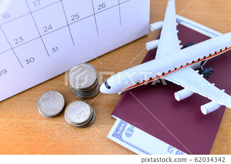 Airplane model with paper calendar on wooden 62034342