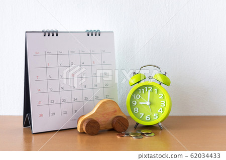 Calendar and car on table. Day of buying or 62034433