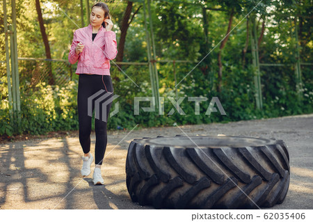Sports girl training ain a summer park Sports girl training ain a summer park 62035406