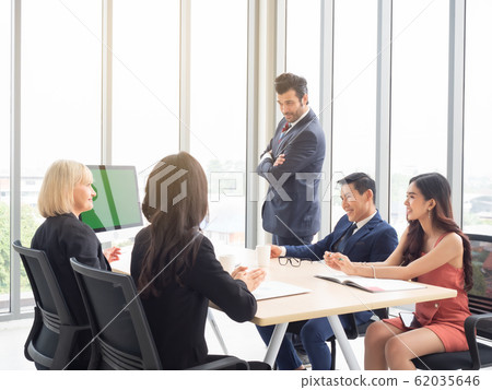 Businessman presentation job plans to the meeting. Business teamwork having meeting in modern office. Businessman presentation job plans to the meeting. Business teamwork having meeting in modern office. 62035646
