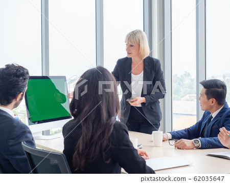 Businesswoman presentation job plans to the meeting. Business teamwork having meeting in modern office. Businesswoman presentation job plans to the meeting. Business teamwork having meeting in modern office. 62035647